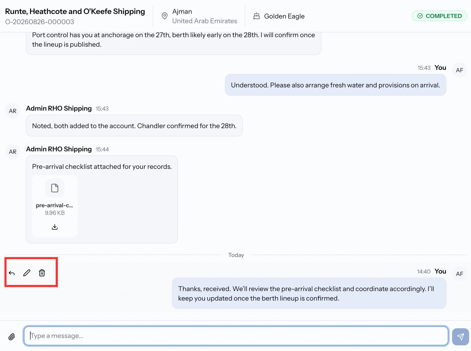 PortzApp chat thread for job O-20260826-000003 at Ajman showing the reply, edit and delete actions on a message, an attached pre-arrival checklist, and the vessel and status in the header
