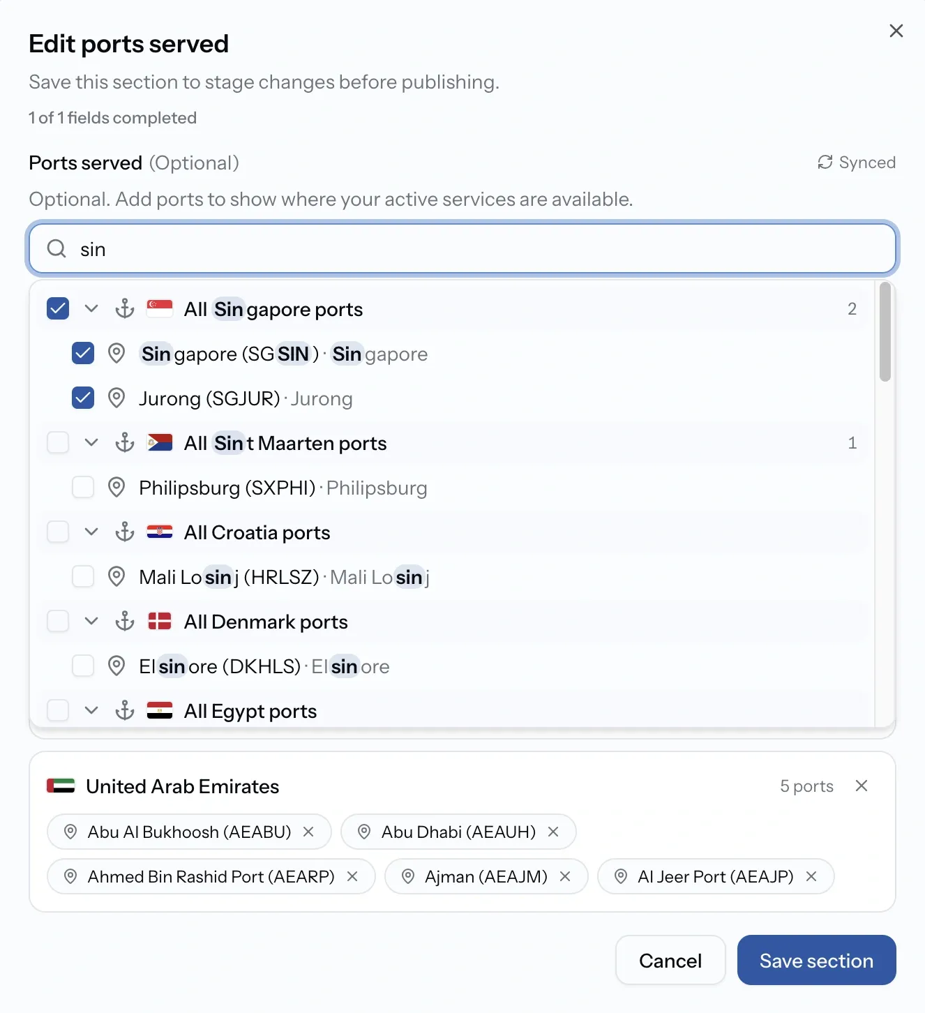 Editing the Ports card on a company profile, showing a whole country selected and individual ports chosen within another
